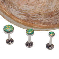 Green olive opal flat back body piercing by Body Clickers in 14g, 16g, or 18g gauge showing the jewelry's vibrant color and smooth design.