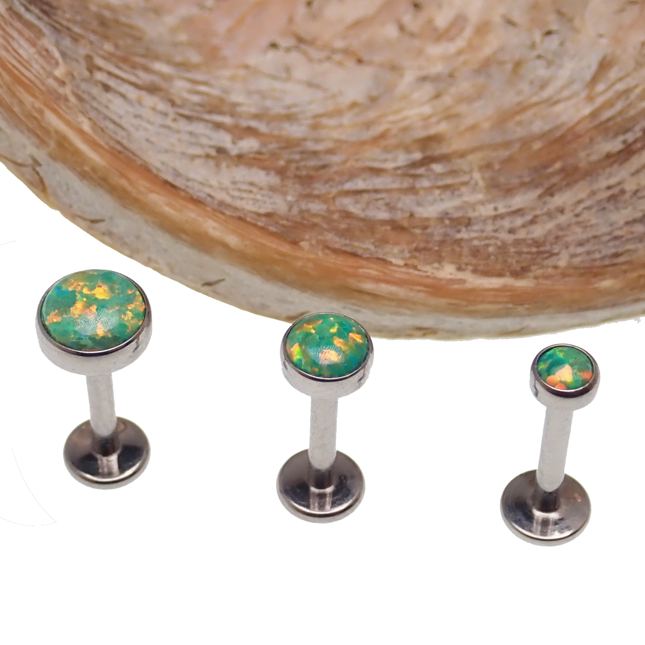 Green olive opal flat back body piercing by Body Clickers in 14g, 16g, or 18g gauge showing the jewelry's vibrant color and smooth design.
