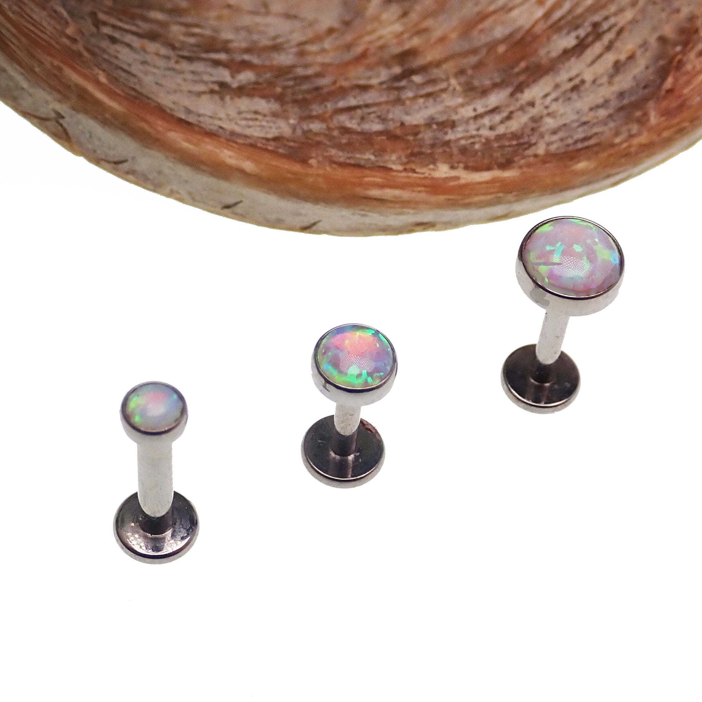 Opalite peach opal flat back body piercing in 14g, 16g, or 18g from Body Clickers, showcasing the smooth, colorful gemstone jewelry.