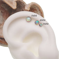 Opalite Peach Opal flat back body piercing in 14g, 16g, or 18g, made by Body Clickers, shown in close-up view.