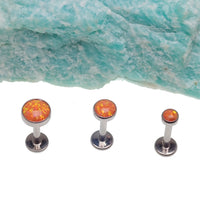 Orange fire opal flat back body piercing by Body Clickers, available in 14g, 16g, and 18g, with 3mm or 6mm sizes.