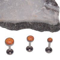 Orange Fire Opal flat back body piercing in 18g, 16g, and 14g gauges by Body Clickers, featuring a 3mm or 6mm gemstone.