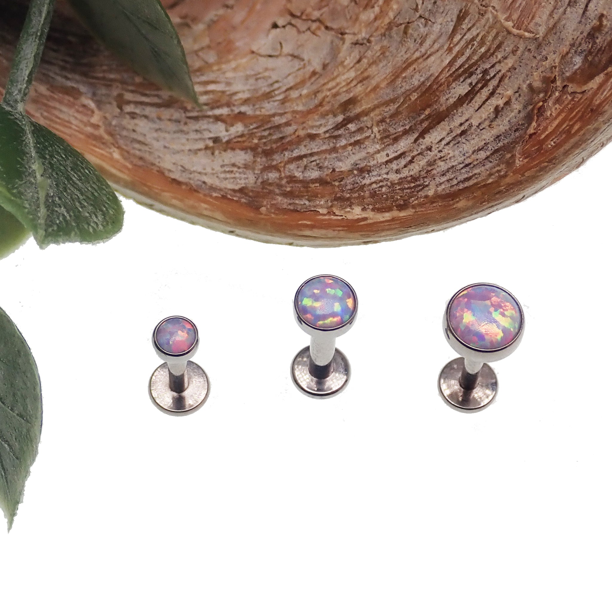 Unicorn opal flat back body piercing in 14g, 16g, or 18g by Body Clickers, featuring a colorful 3mm or 6mm gemstone.