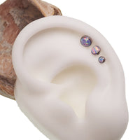 Unicorn opal flat back body piercing jewelry by Body Clickers in 14g, 16g, and 18g with colorful gemstone design.