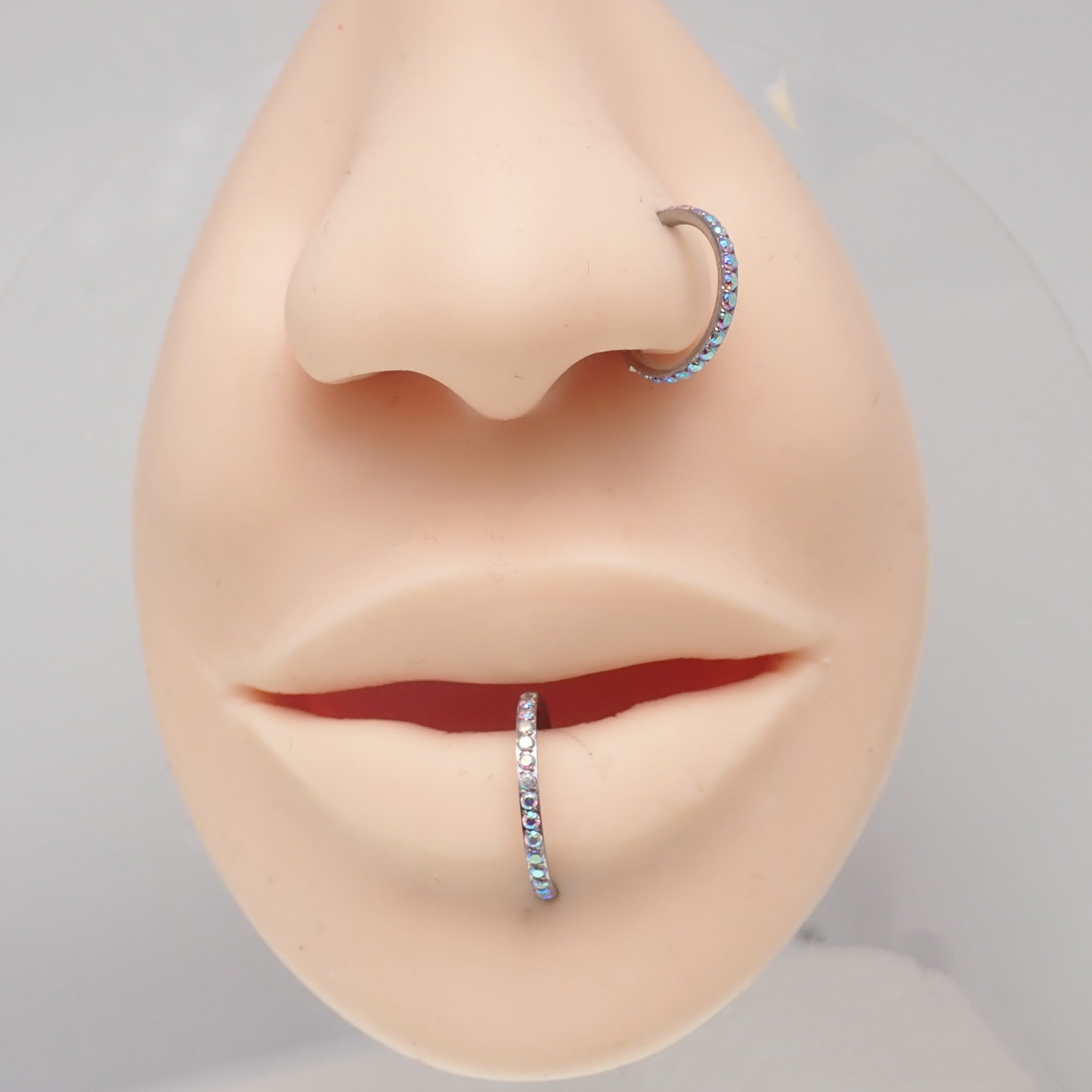 Sparkly titanium CZ clicker body jewelry in 16g with 6mm AB stones, designed by Body Clickers for piercing adornment.