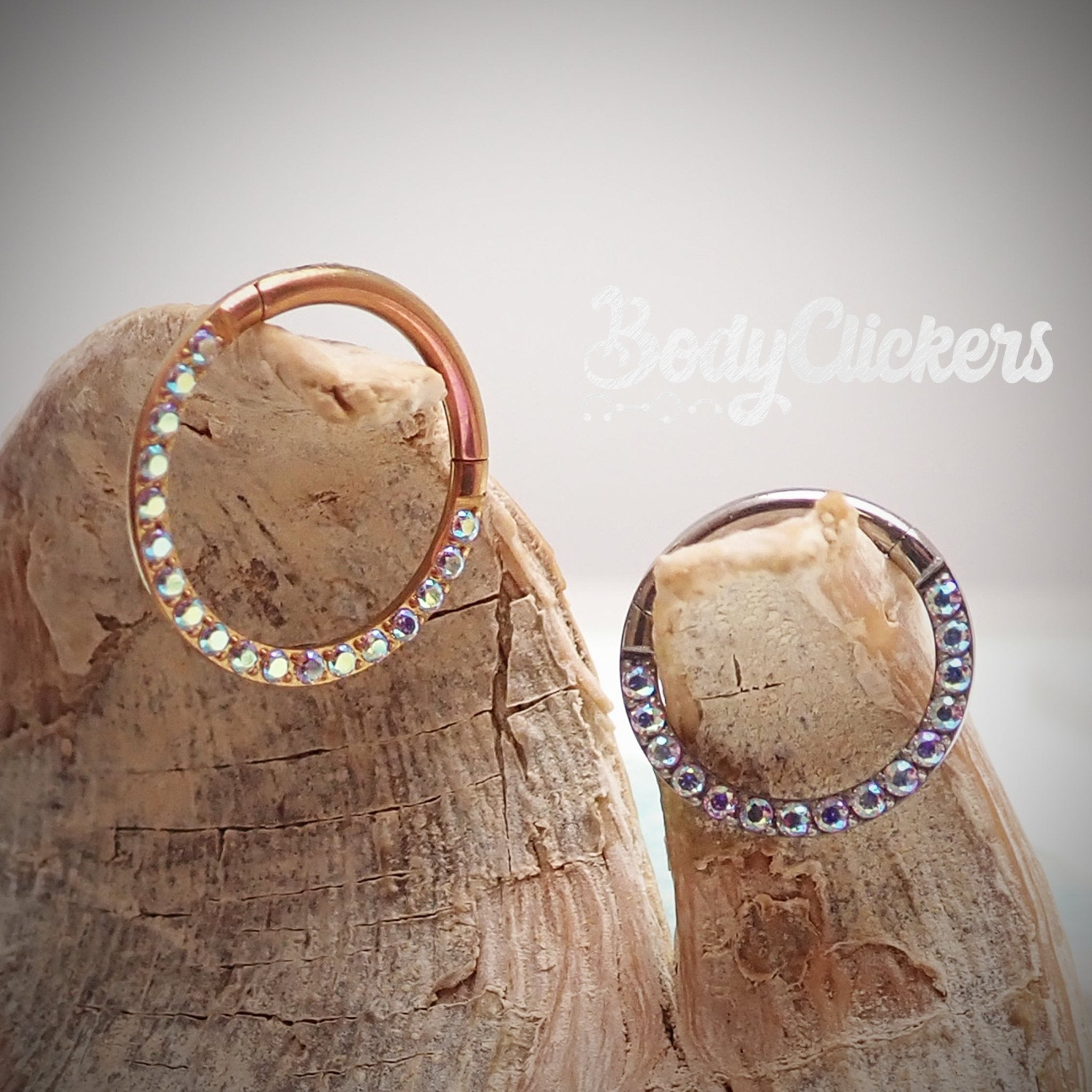 Titanium daith ring with Aurora Borealis CZ gemstones, 16g Body Jewelry by Body Clickers, featuring a clicker design.