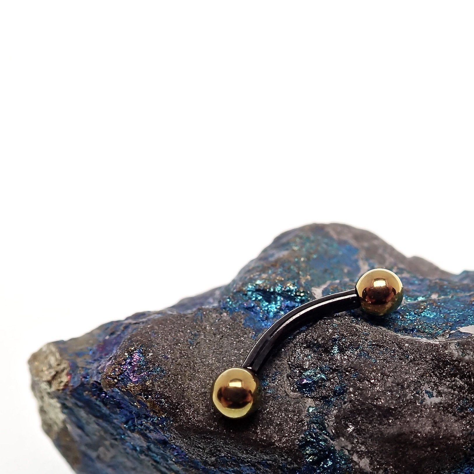 Black and gold titanium curved barbell ring, 16g, internally threaded body jewelry by Body Clickers, 6mm diameter.