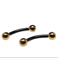 Black and gold titanium curved barbell ring, 16g, internally threaded body jewelry by Body Clickers, showcasing the stylish design.