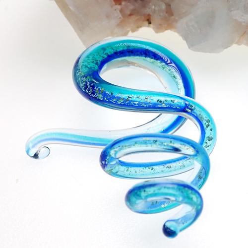 Pair of blue glass ear spirals body jewelry from Body Clickers, 6mm size, featuring smooth, curved glass designs for pierced ears.