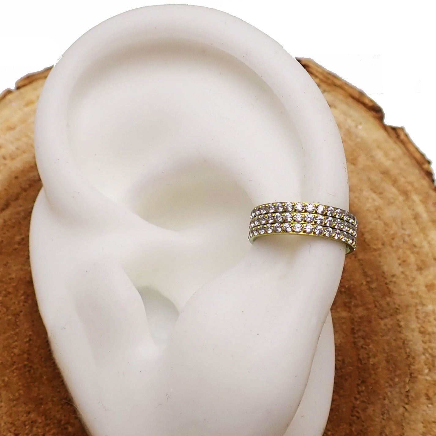 Three-layer zircon clicker body jewelry in 16g with a silver finish, featuring sparkling zircon stones on a versatile clicker design.