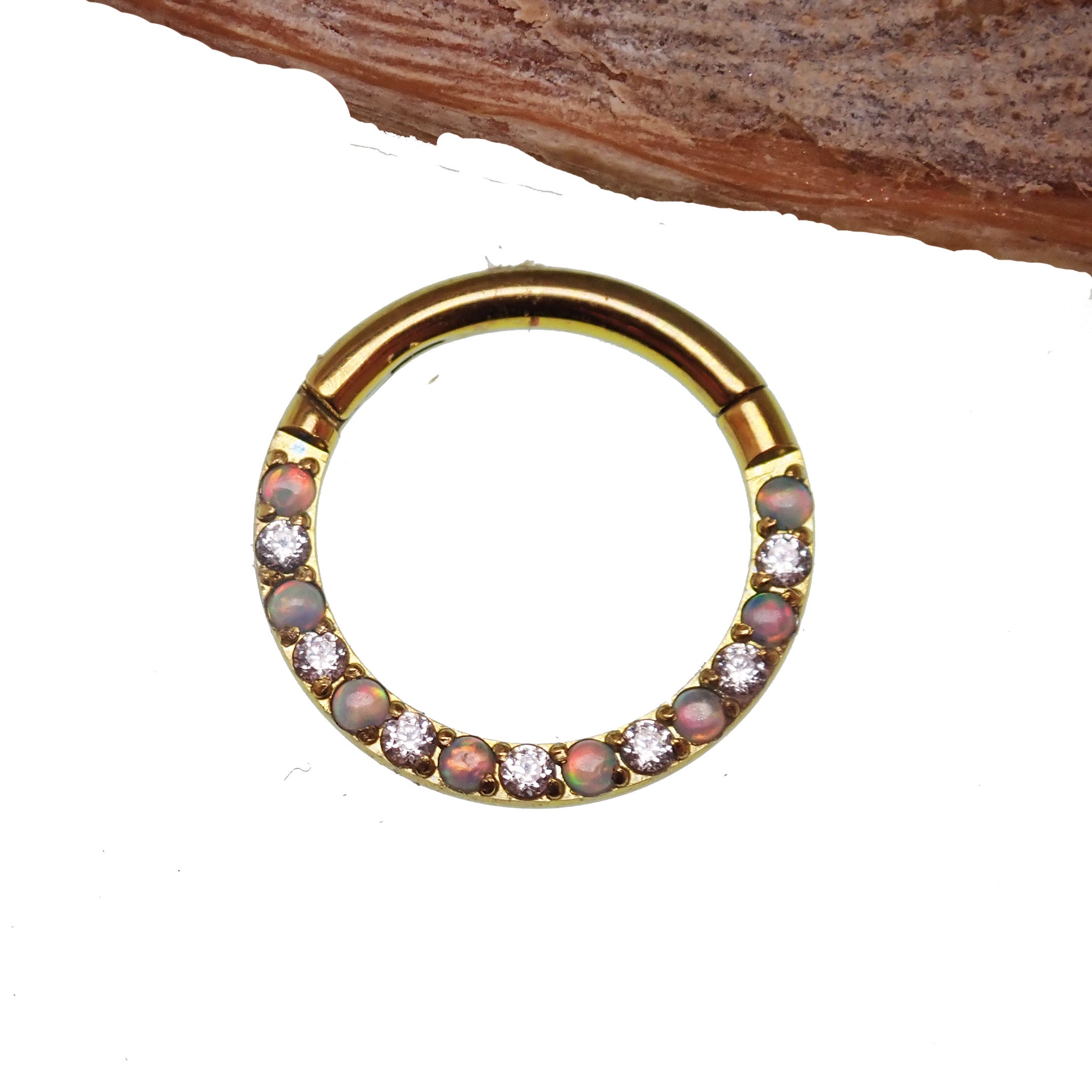 Titanium opal and crystal clicker body jewelry in 16g with a 6mm design, featuring colorful opal and clear crystal accents.