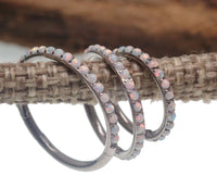 White fire opal titanium clicker body jewelry in 16g with 6mm gemstone, designed for piercings by Body Clickers.