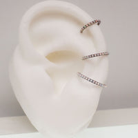 White fire opal titanium clicker body jewelry in 16g with 6mm gemstone for piercing adornment
