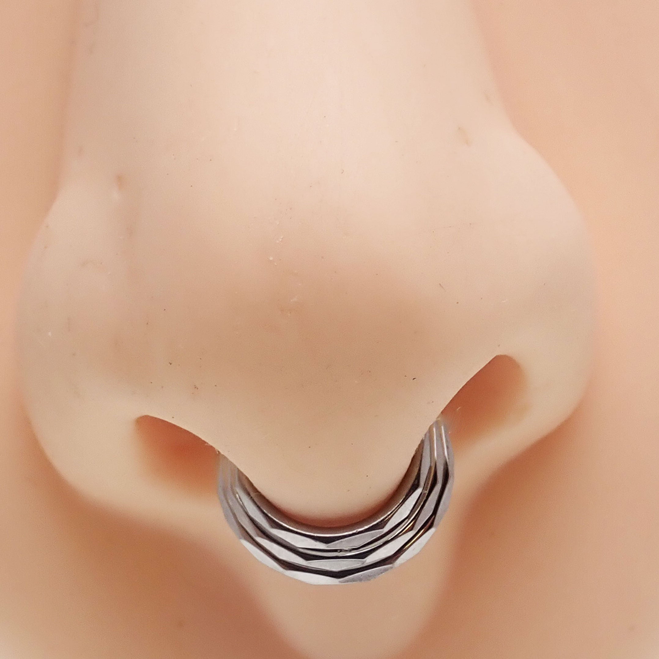 Titanium 3-stack beveled clicker body jewelry in 16g with stacked design, by Body Clickers, displayed on a white background.