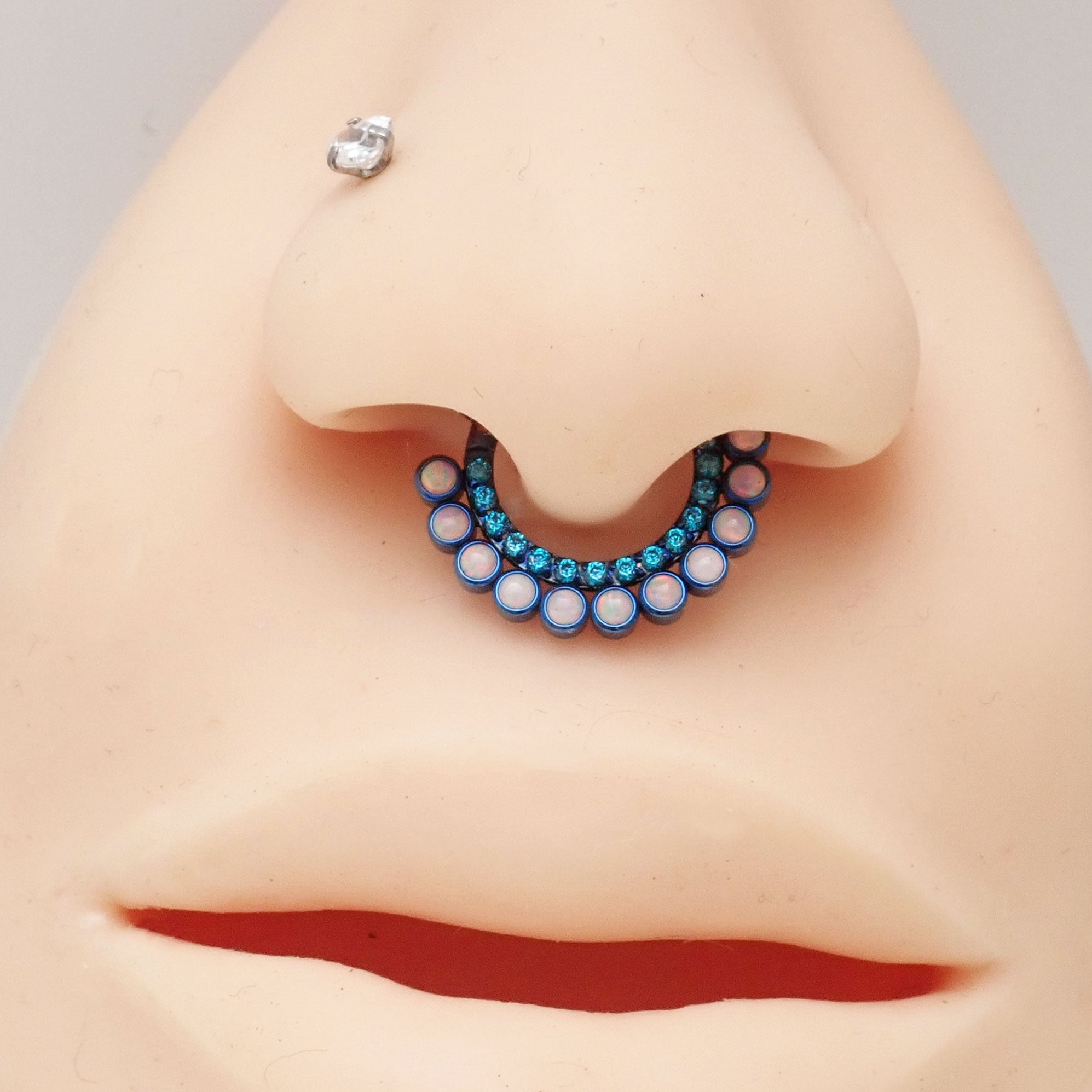 Blue zircon and white fire opal titanium clicker body jewelry, 16g, with 8mm stones, from Body Clickers.
