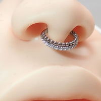 Titanium body jewelry featuring a clear crystal and bead clicker design in 16g size by Body Clickers