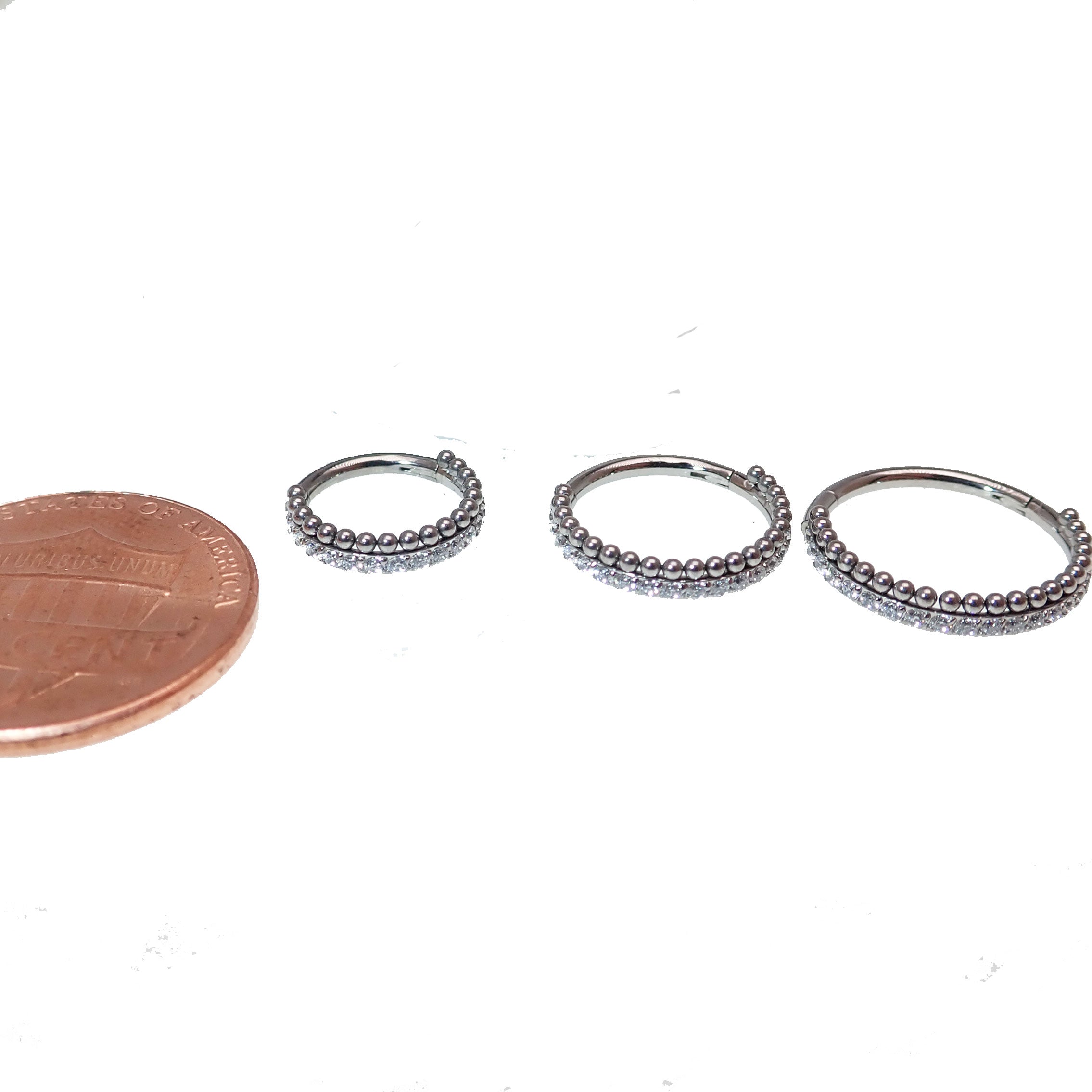 Titanium body jewelry with clear crystal beads and a clicker design, 16g, by Body Clickers, featuring sparkling CZ accents.