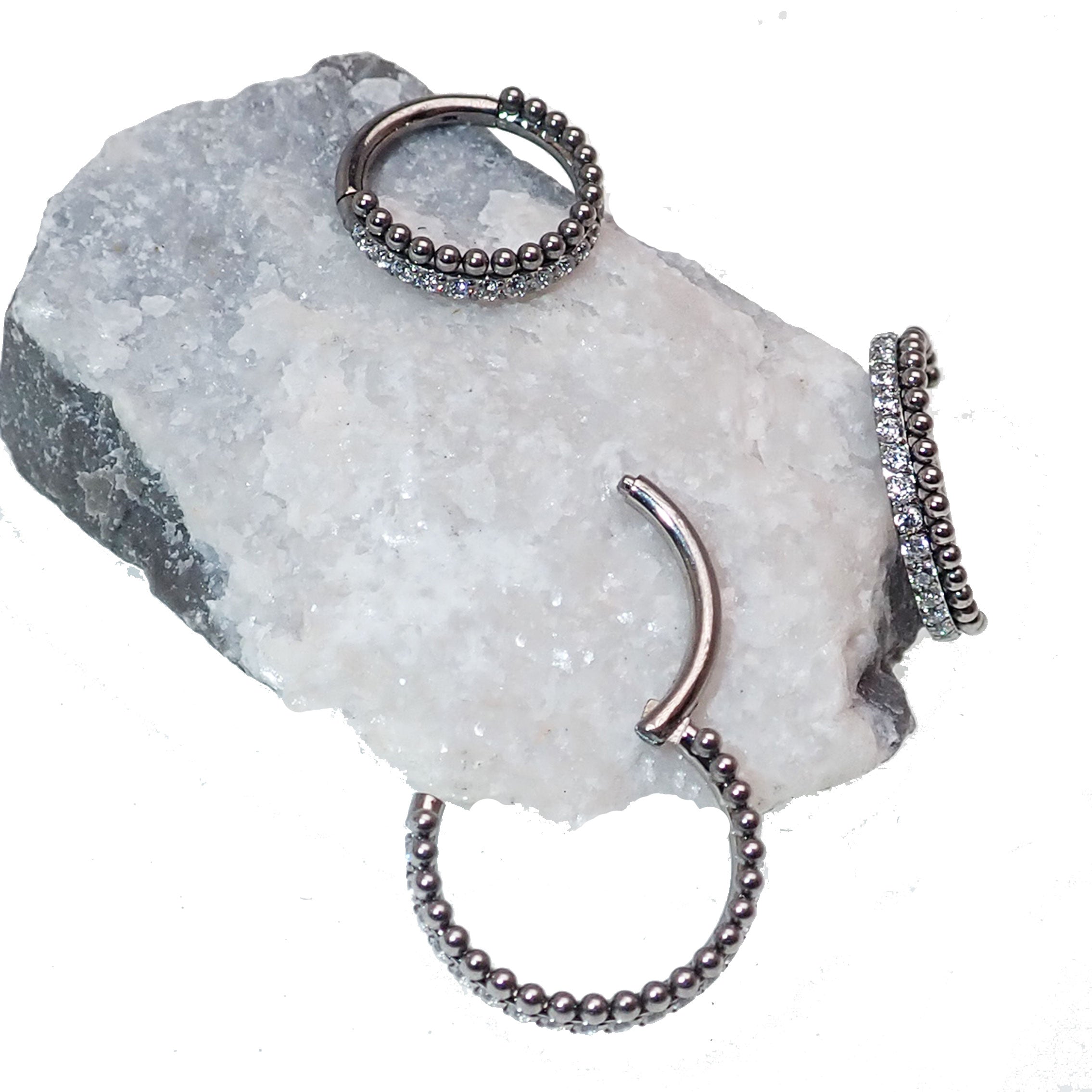 Clear crystal and bead titanium clicker body jewelry in 16g with sparkling CZ accents by Body Clickers.