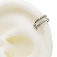 Clear CZ double row titanium clicker body jewelry in 16g with a sleek design, perfect for jewelry enthusiasts.