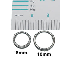 Clear CZ double row titanium clicker body jewelry in 16g with sparkling stones and sleek design, suitable for piercings.