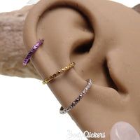 Titanium Crisscross-Etched Clicker body jewelry in 16g with engraved design, featuring a sleek and stylish appearance.