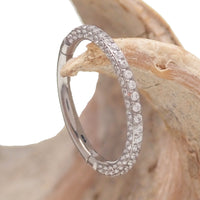 CZ-Encased Hinged Titanium Clicker body jewelry in 16g with CZ stones, suitable for conch, septum, helix, daith, rook, lip, and nose piercings.