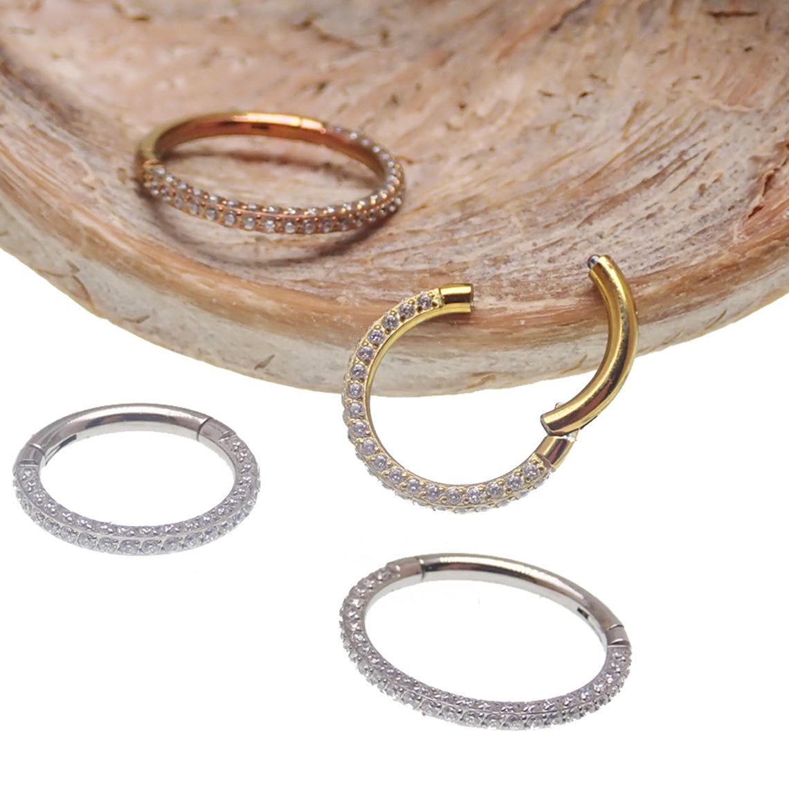 Hinged titanium clicker body jewelry with CZ stones, 16g size, shown from all sides for nose, septum, helix, and daith piercings.