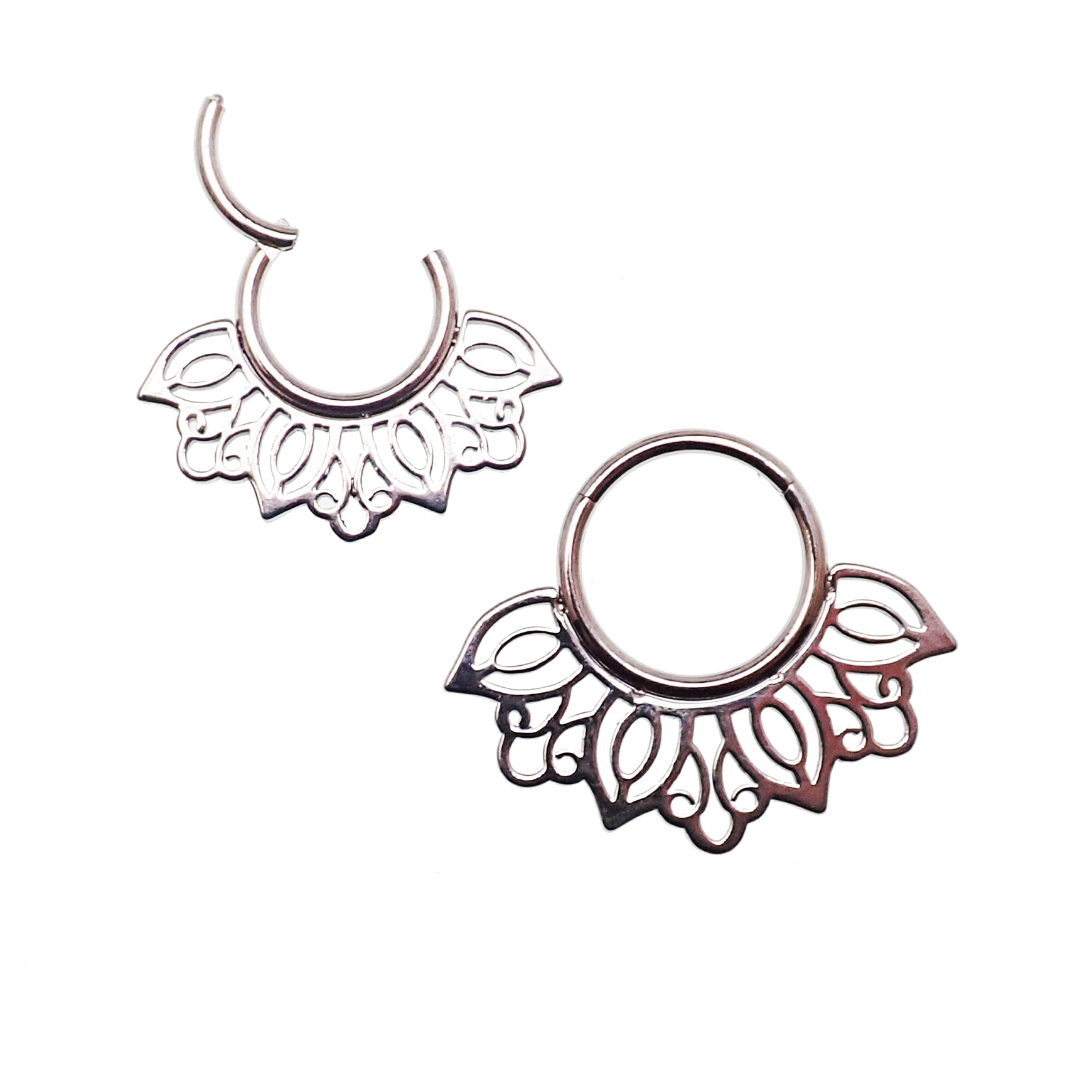 Filigree titanium 16g clicker body jewelry with intricate design, made by Body Clickers, shown in the image.