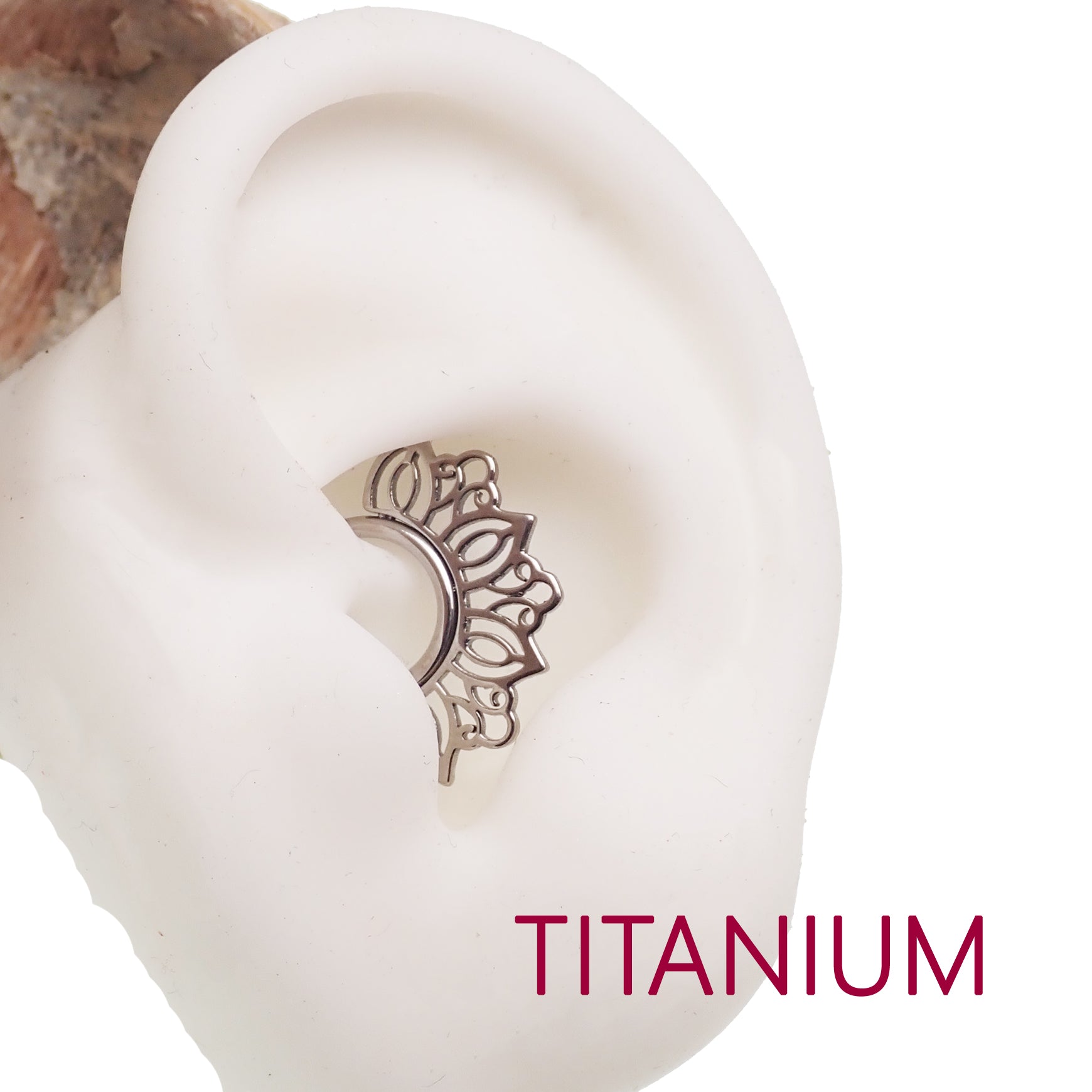 Filigree titanium 16g clicker body jewelry with intricate openwork design, suitable for piercings and stylish body adornment.