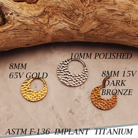 Hammered titanium 16g clicker body jewelry with 8mm diameter from Body Clickers, featuring a textured hammered finish.