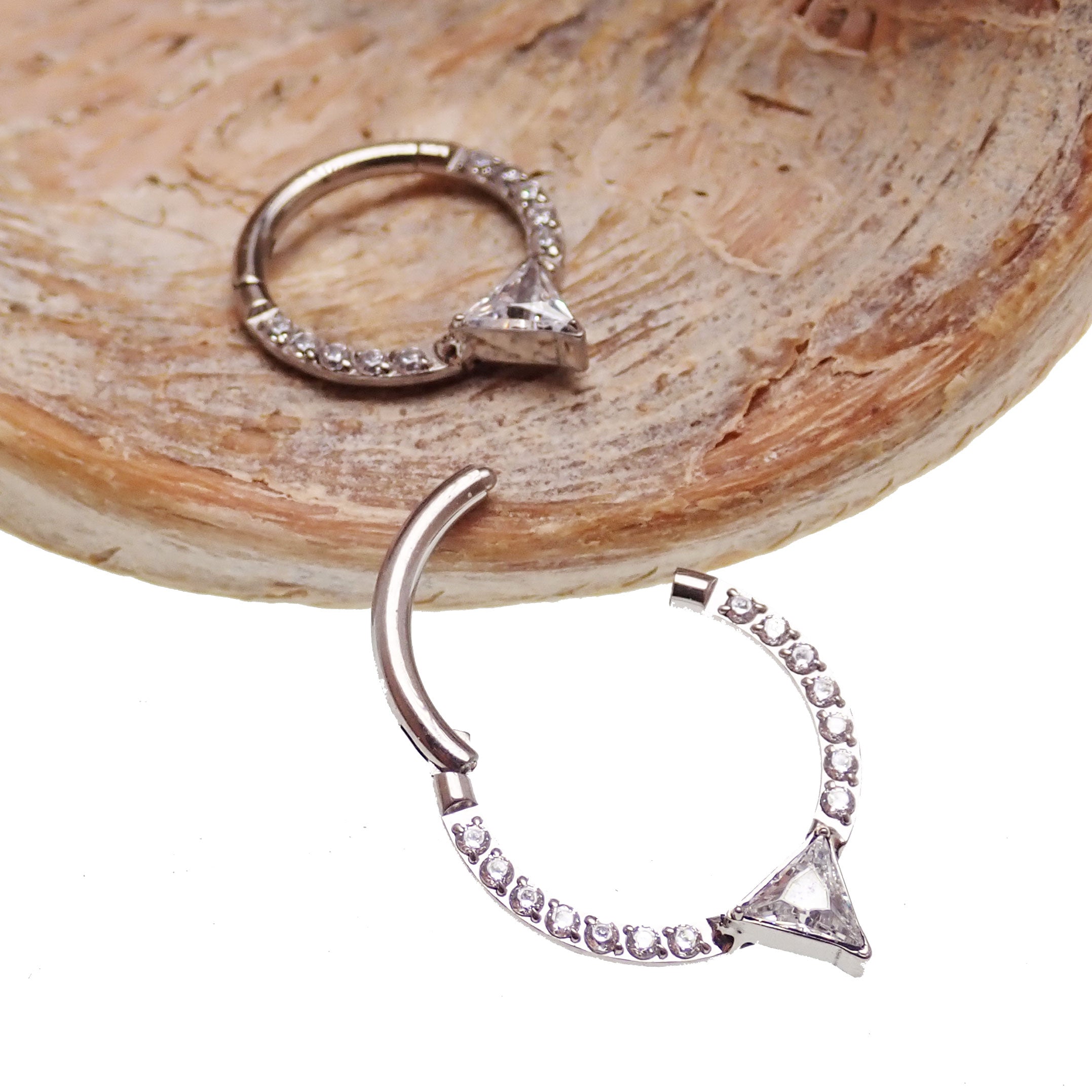 Hinged body jewelry clicker with triangle-shaped CZ, 16g, from Body Clickers, featuring an 8mm diameter design.