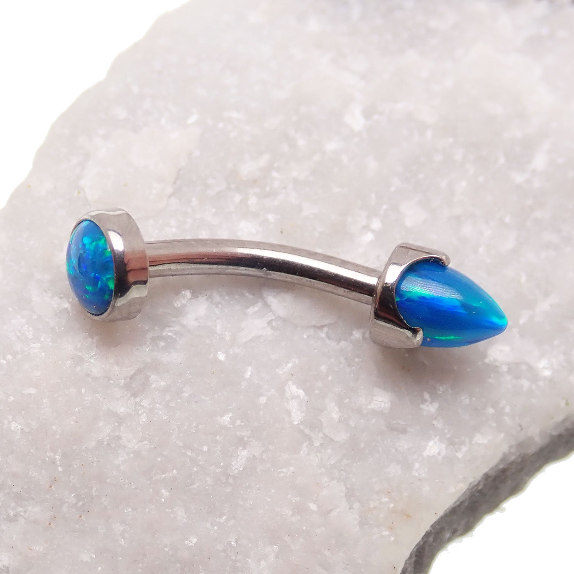 Peacock blue curved opal spike bar with cabochon top body jewelry by Body Clickers, 14g, for pierced ears or body.