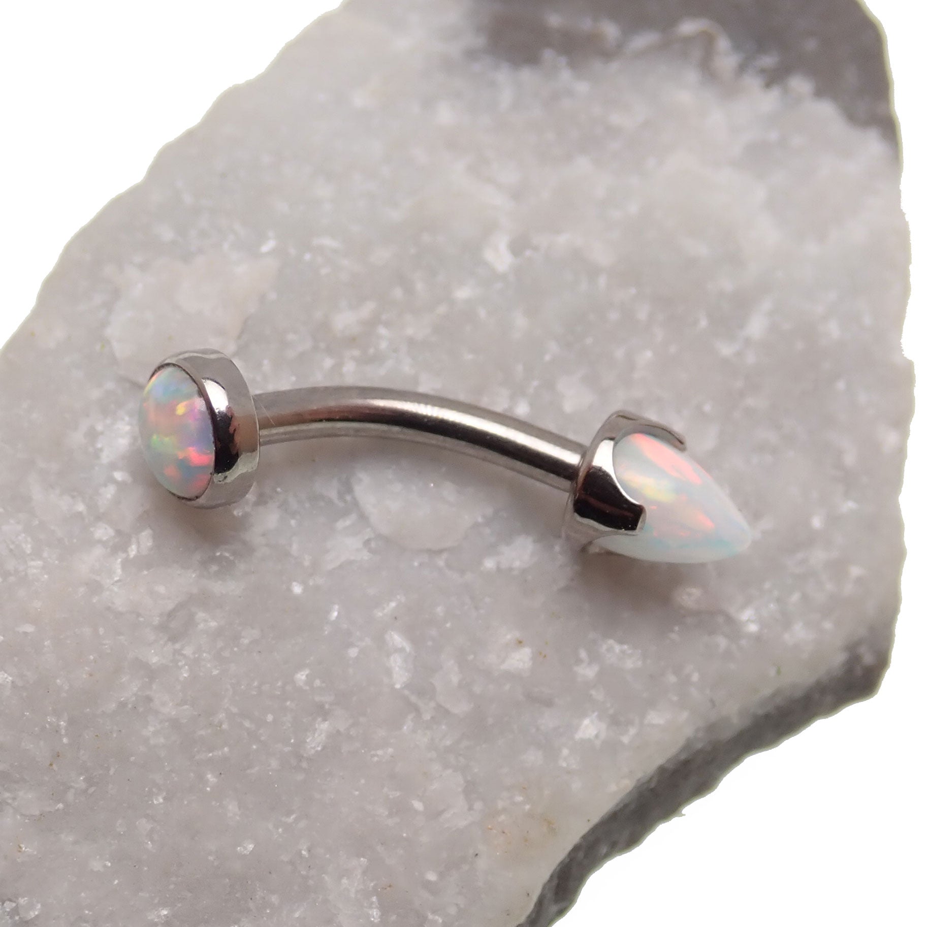 Body Clickers curved opal spike bar with cabochon top, 14g body jewelry featuring a white opal and modern design.