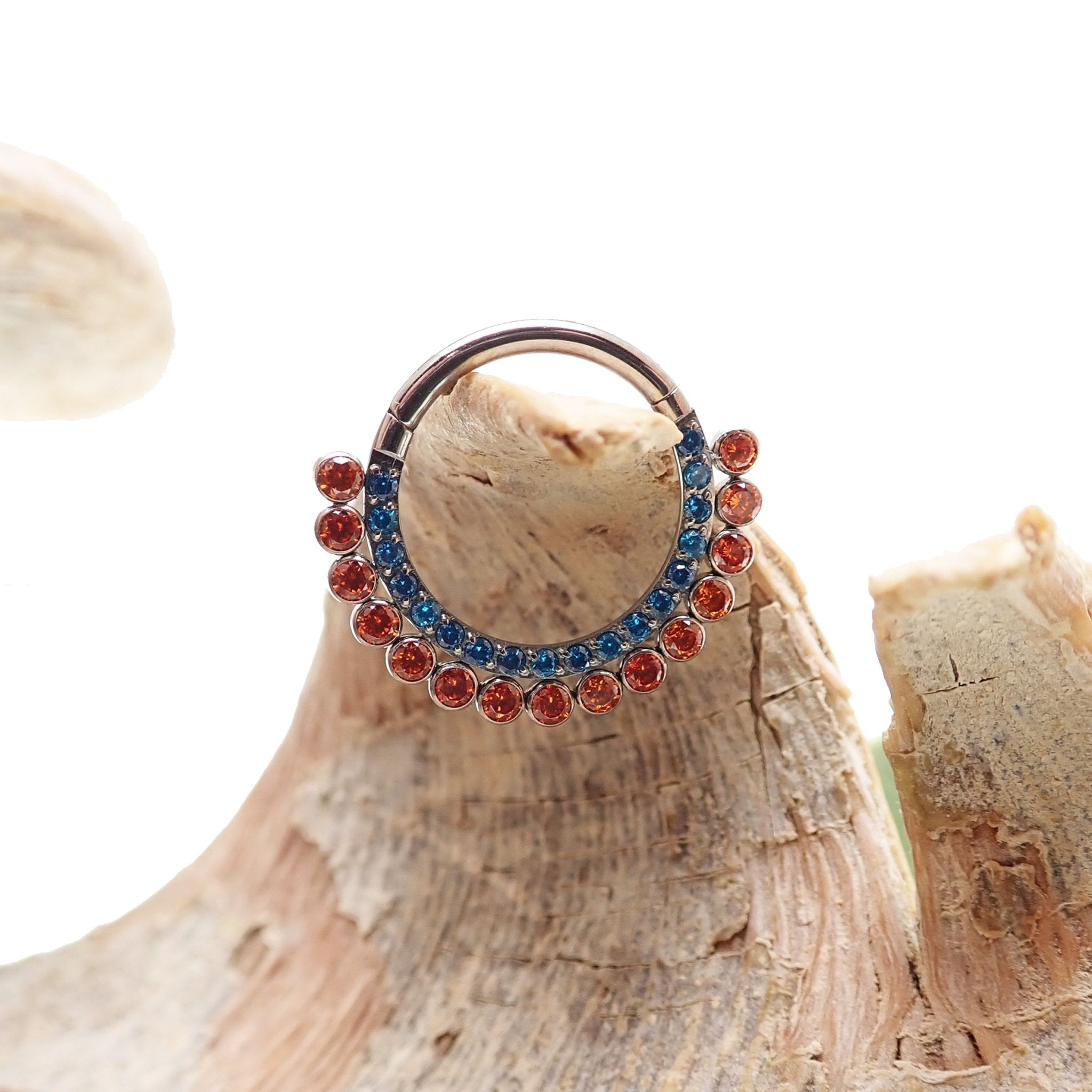 Orange and blue CZ titanium clicker body jewelry in 16g with 8mm diameter, designed for body piercing by Body Clickers