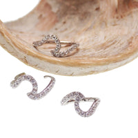 Titanium Wave and CZ clicker body jewelry in 16g, featuring a sleek wave design with sparkling cubic zirconia accents.