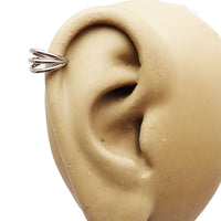Tri-hoop titanium clicker body jewelry by Body Clickers, 16g, with 8mm hoops and sleek, modern design.
