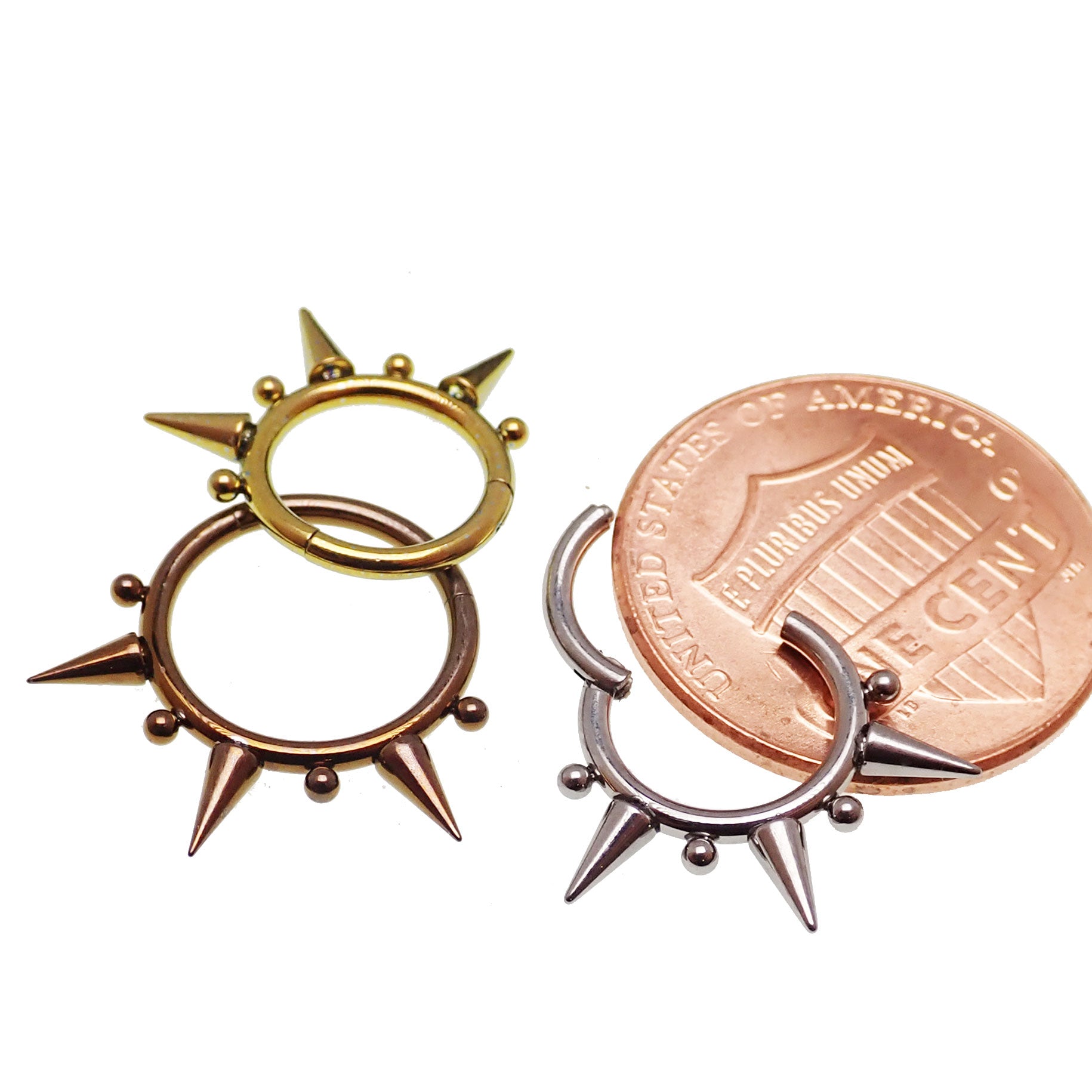 Tri-spiked beaded septum clicker in 16g body jewelry by Body Clickers, featuring a curved design with beaded and spiked details.