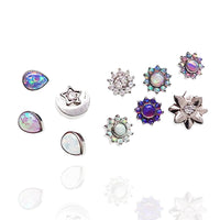 CZ Daisy, Opal Tear, and Moon dermal titanium tops for 14g body jewelry by Body Clickers, shown on a display.