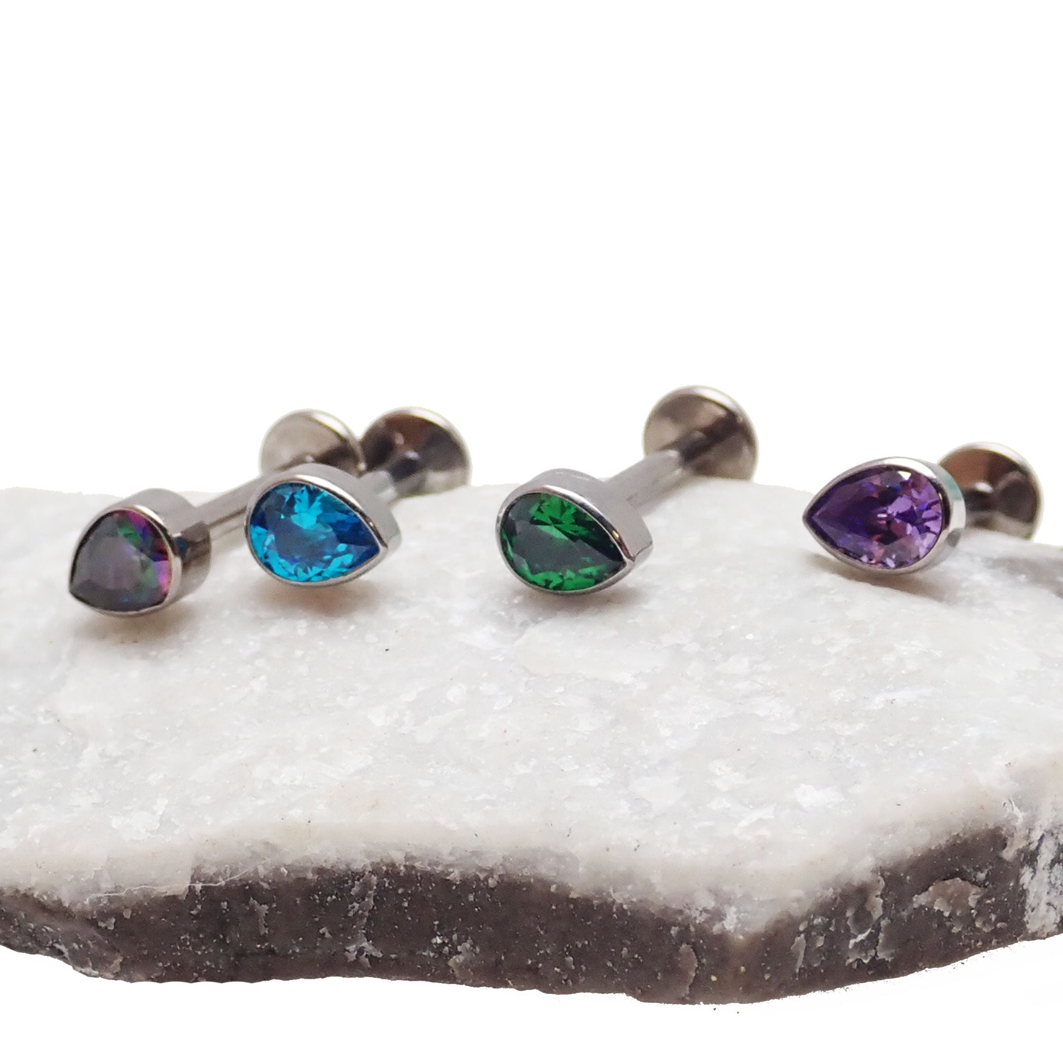 Body Clickers CZ Teardrop Flat Back body jewelry in 14g, 16g, or 18g with a sparkling teardrop design for piercings.