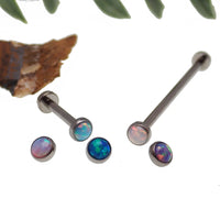 Titanium industrial barbell with 4mm flat opal ends in 16g, body jewelry by Body Clickers, featuring a sleek blue design.
