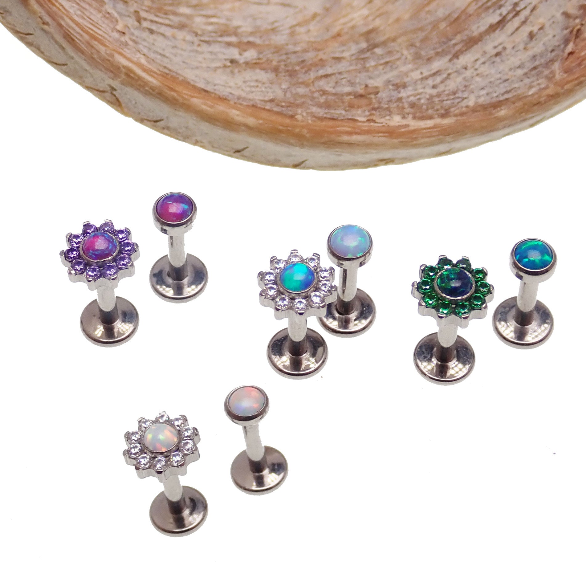 Azure blue flower and flat-top opal CZ body jewelry pair by Body Clickers, 14g internally threaded 0.9mm thread, ideal for body piercings.