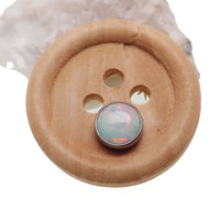 White cabochon opal top body jewelry by Body Clickers, 16g, featuring a smooth, polished opal gemstone for body piercing accessories.