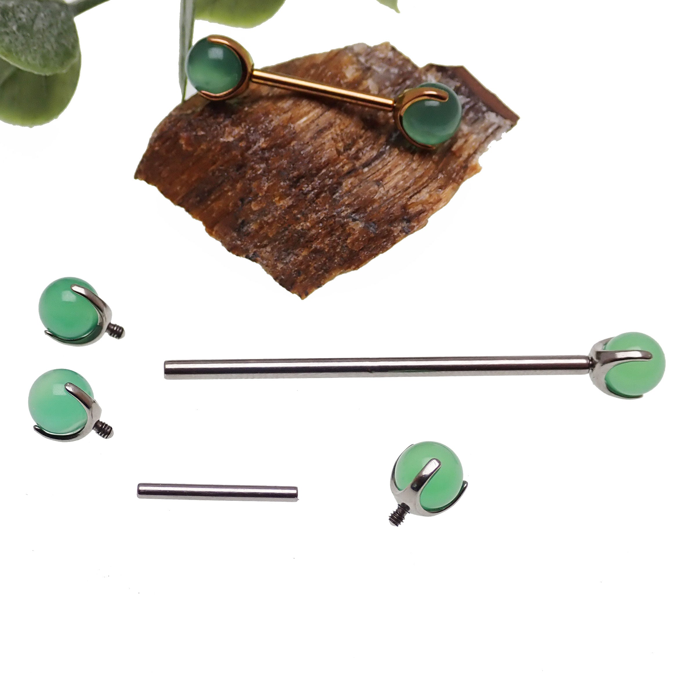 Jade titanium barbell piercing by Body Clickers Body Jewelry in 12g or 14g with 12mm length, shown in close-up view.