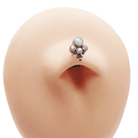 Floating titanium belly bar piercing by Body Clickers, 14g, 10mm curved belly ring with smooth finish and secure ball closure.