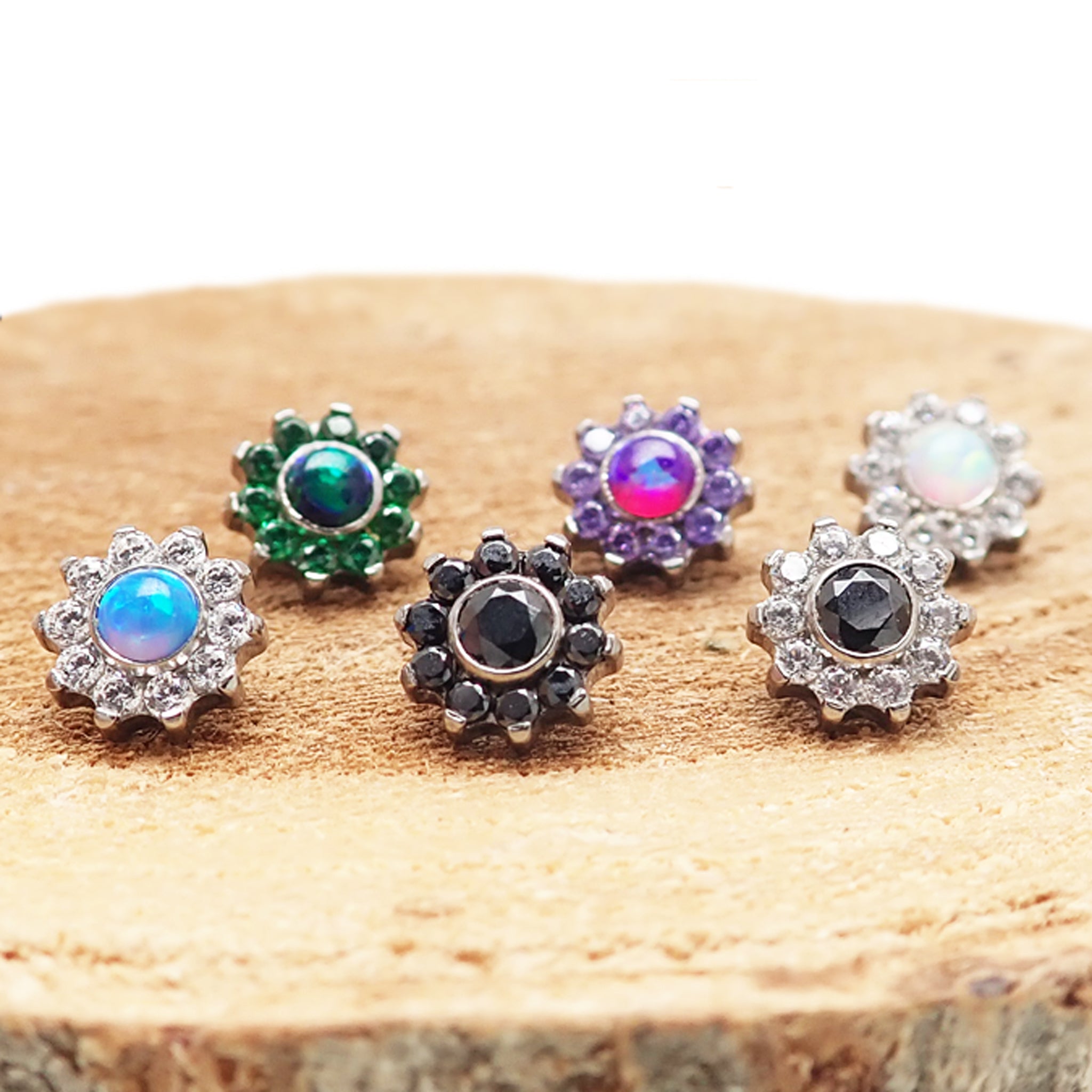 Body Clickers CZ and opal daisy top attachments for 16g body jewelry, featuring floral design and sparkling stones.