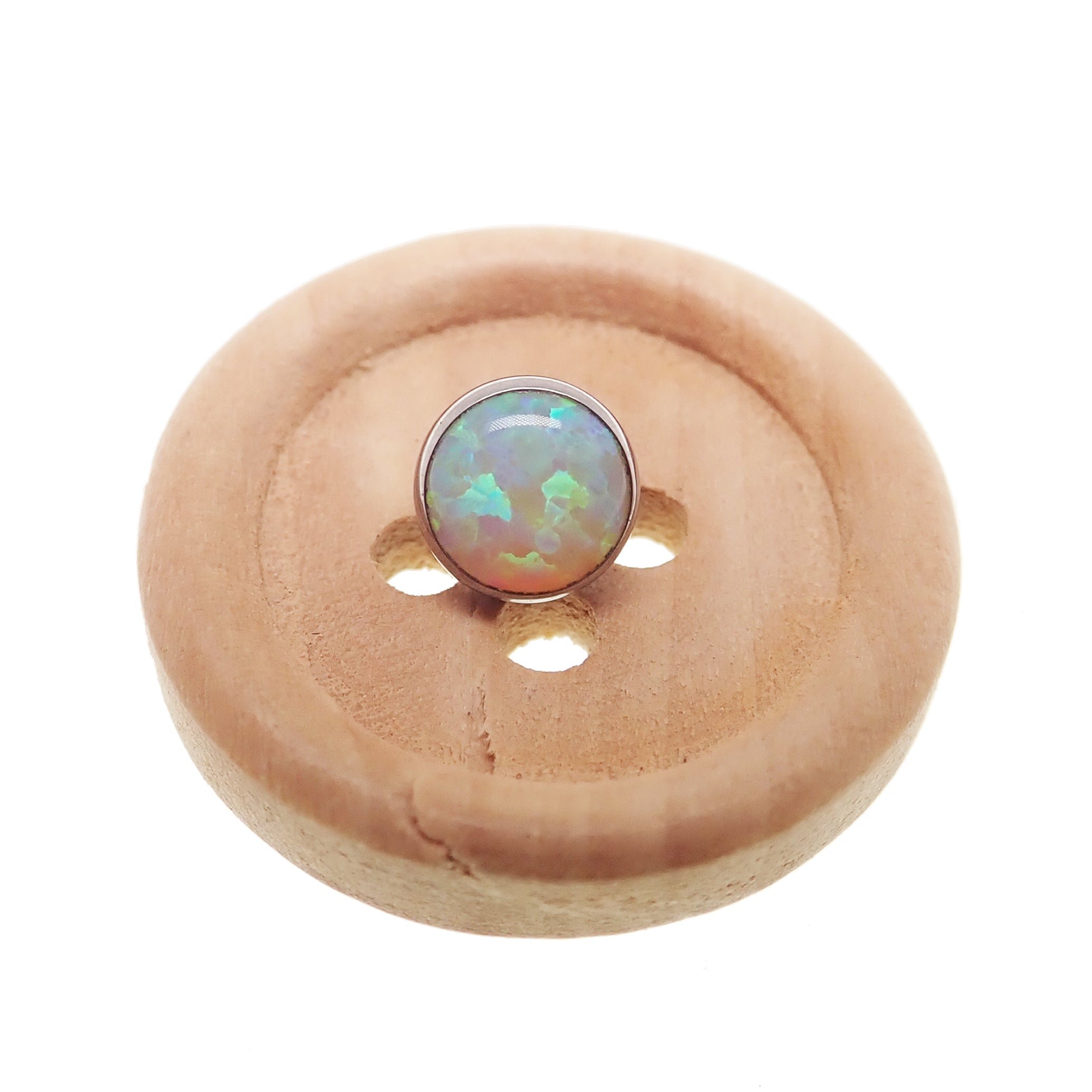 Black fire Opal push fit threadless top body jewelry by Body Clickers, made with implant-grade titanium, featuring a 3mm Opal gemstone.
