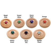 Black fire opal push fit threadless top body jewelry in implant titanium by Body Clickers, designed for body piercing.