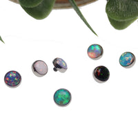 Body Clickers 14g cabochon 4mm opal flat attachment body jewelry, showcasing a shiny blue oval gemstone.