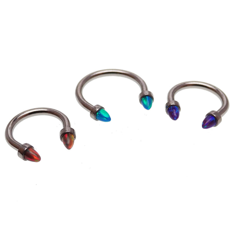 Black horseshoe body jewelry with 3mm spiked opal cone ends, 16g size, featuring a sleek, curved design for body piercing.
