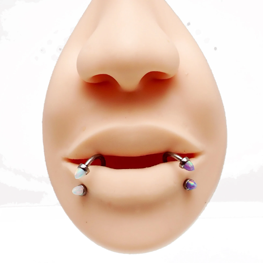 Black horseshoe piercing with 3mm spiked opal cone ends, 16g body jewelry from Body Clickers, featuring an open horseshoe design.